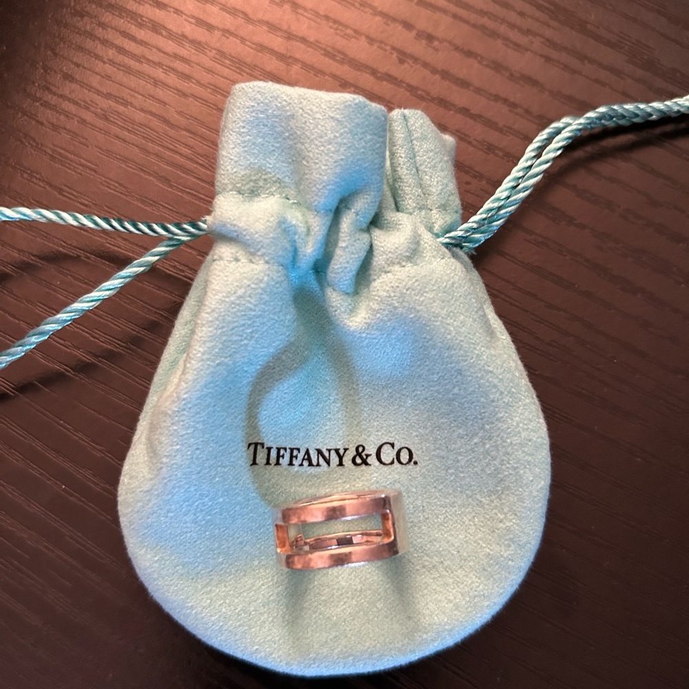 Tiffany & Co. Sterling silver thick gold band. Very contemporary.